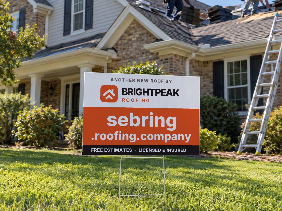 sebring.roofing.company on a yard sign in front of a house getting a new roof